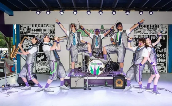 The band in matching suits on Fountain Square in downtown Cincinnati, set up in the snow